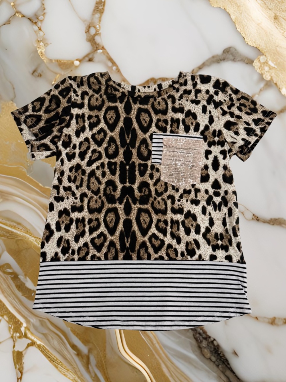 Women’s cheetah print shirt with white stripes and a sparkly gold pocket